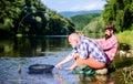 Fly fish hobby of men. retirement fishery. Two male friends fishing together. big game fishing. relax on nature. happy Royalty Free Stock Photo