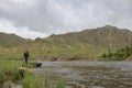 Fly fisherman casting a fly on a river in Mongolia during the summer, Moron, Mongolia