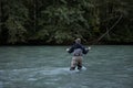 A Fly Fisherman casts his line for a fish on the Squamish River
