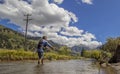 Fly Fisherman on a crystal clear Colorado Rocky mountain trout s