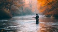 Fly fisherman fishing for Atlantic Salmon on the Margaree River in the fall. Royalty Free Stock Photo