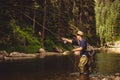 A fly fisherman fishing for trout on the mountain river in Northern Idaho Royalty Free Stock Photo