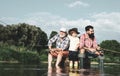 Fly fishing. Father, son and grandfather relaxing together. Coming together. Family generation and people concept. Hobby Royalty Free Stock Photo