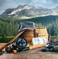 Fly fishing gear on wooden deck with lake Royalty Free Stock Photo