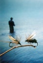 Fly fishing lures - flies with fisherman Royalty Free Stock Photo