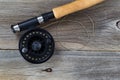 Fly Fishing Reel and Line on rustic wood Royalty Free Stock Photo