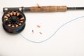 Fly fishing reel, rod, and flies on a white background Royalty Free Stock Photo