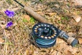 A fly fishing rod lies on dry grass Royalty Free Stock Photo