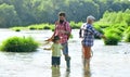 Fly fishing. Senior man fishing with son and grandson. Male multi generation family. Family generation and people Royalty Free Stock Photo