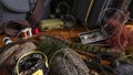 Fly Fishing Still Life. Materials and tools for tying lures on a wooden table. Hobby concept. Royalty Free Stock Photo