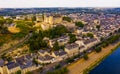 Fly over picturesque town of Saumur and medieval castle Saumur. France Royalty Free Stock Photo