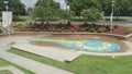 Fly over a water fountain to landscape view