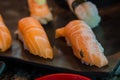 Fly on sushi salmon . fly eat salmon fish , carrier of communicable diseases, f