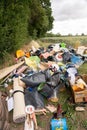 Fly tipping of household waste in a country lane. Hertfordshire. UK Royalty Free Stock Photo