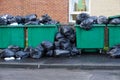 Fly tipping of waste and rubbish black bin bags in residential area