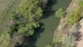 Fly view above dead river channel in central European lowlands during spring, 4K