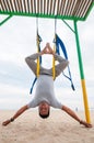 Fly Yoga, man doing yoga exercises on the sea background. Sport and healthy concept Royalty Free Stock Photo