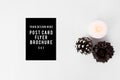 Flyer christmas composition. stylish arrangement of cones and candle on white background. flat lay top view.