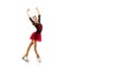 Flyer. Portrait of little flexible girl, figure skater wearing stage attire posing isolated on white studio background