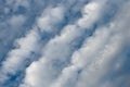 Flyffy clouds in lines in blue summer sky Royalty Free Stock Photo