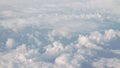 Flying above the clouds in daytime view form airplane window Royalty Free Stock Photo