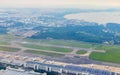 Flying above the clouds and the landscape airport over Singapore Royalty Free Stock Photo