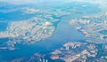 Flying above the clouds and the landscape airport over Singapore Royalty Free Stock Photo