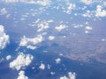 Flying above the clouds over the countryside of Thailand Royalty Free Stock Photo