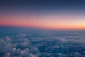 Flying above the clouds. Aerial view from the airplane Royalty Free Stock Photo