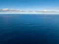 Flying from above of Deep Blue Sea. Philippines. Royalty Free Stock Photo