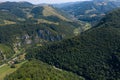 Flying above a deep valley and deciduous forest by drone Royalty Free Stock Photo