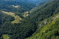 Flying above a deep valley and deciduous forest by drone Royalty Free Stock Photo