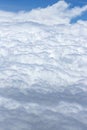 Flying above a dense layer of white clouds. Great and beautiful clouds. Royalty Free Stock Photo