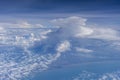 Flying above the earth and above the clouds in territory Singapore. Airplane window view Royalty Free Stock Photo