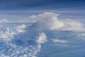 Flying above the earth and above the clouds in the territory of Singapore. Airplane window view. The plane flies in sky above the Royalty Free Stock Photo