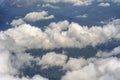 Flying above the earth and above the clouds in the territory of Kota Kinabalu, Borneo, Malaysia. Airplane window view. The plane