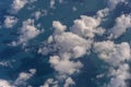 Flying above the earth and above the clouds in the territory of Singapore. Airplane window view. The plane flies in sky above the Royalty Free Stock Photo