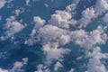 Flying above the earth and above the clouds in the territory of Singapore. Airplane window view. The plane flies in sky above the Royalty Free Stock Photo