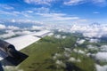 Flying above the earth and above the clouds in territory of Tanzania, Africa Royalty Free Stock Photo