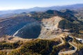 Flying above an open pit mine, copper excavation in Rosia Poieni, Romania. Aerial view Royalty Free Stock Photo