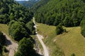 Flying above a valley and deciduous forest by drone Royalty Free Stock Photo