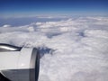 Flying above the white clouds across two continents Royalty Free Stock Photo