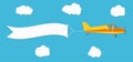 Flying advertising banner. Plane with horizontal banner on blue sky background Royalty Free Stock Photo