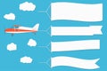 Flying advertising banner. Plane with horizontal banners on blue sky background.