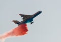 Flying aerial firefighting pour water over the fire for a demo flight in Zhukovsky during MAKS-2019 airshow.