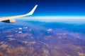 Flying airplane over Mexico Clouds Sky Volcanoes Mountains City desert Royalty Free Stock Photo