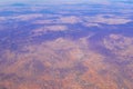 Flying airplane over Mexico Clouds Sky Volcanoes Mountains City desert Royalty Free Stock Photo