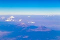 Flying airplane over Mexico Clouds Sky Volcanoes Mountains City desert Royalty Free Stock Photo