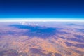 Flying airplane over Mexico Clouds Sky Volcanoes Mountains City desert Royalty Free Stock Photo