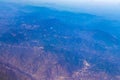 Flying airplane over Mexico Clouds Sky Volcanoes Mountains City desert Royalty Free Stock Photo